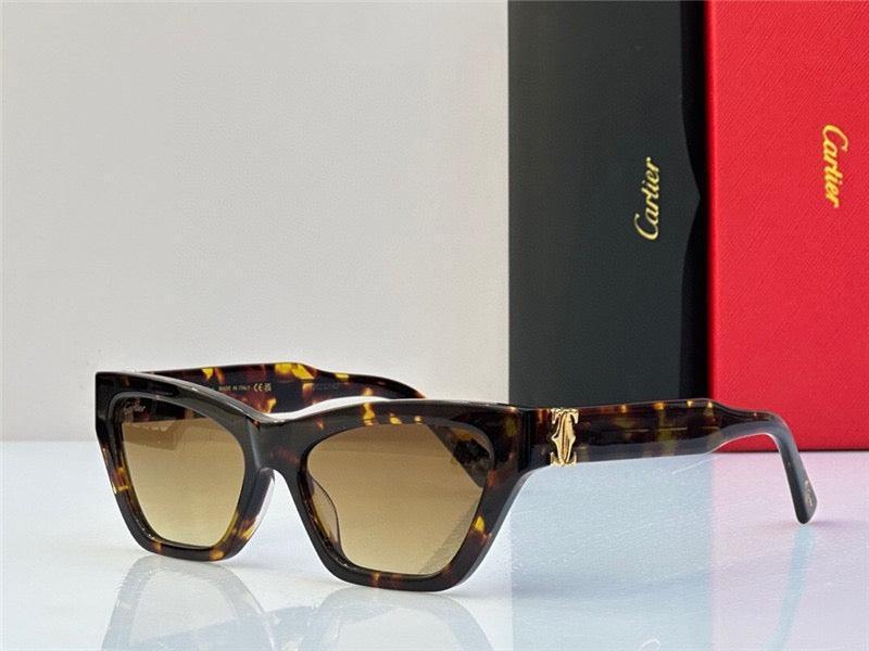 Tortoise shell cat-eye sunglasses with gradient brown lenses and gold detailing on the arms.
