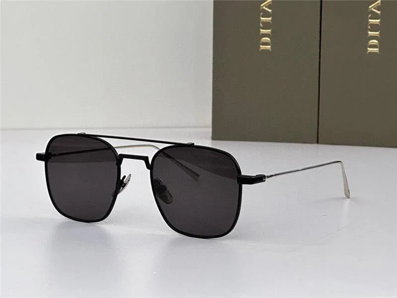 Black square sunglasses with thin metal arms and dark polarized lenses on a white surface