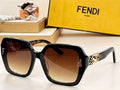 Square oversized black sunglasses with brown gradient lenses and gold accents, Fendi box in background