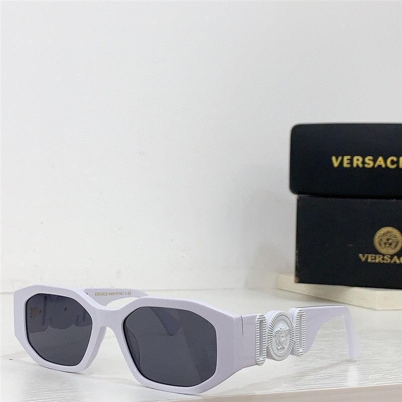 White square sunglasses with geometric frames and dark lenses on a shelf, luxury accessory style
