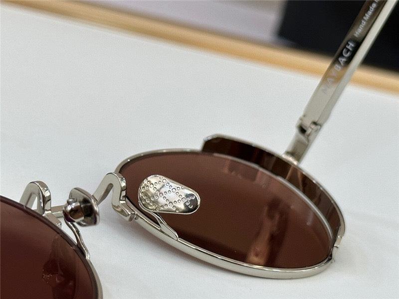 Close-up of metal sunglasses with brown polarized lenses and adjustable nose pads