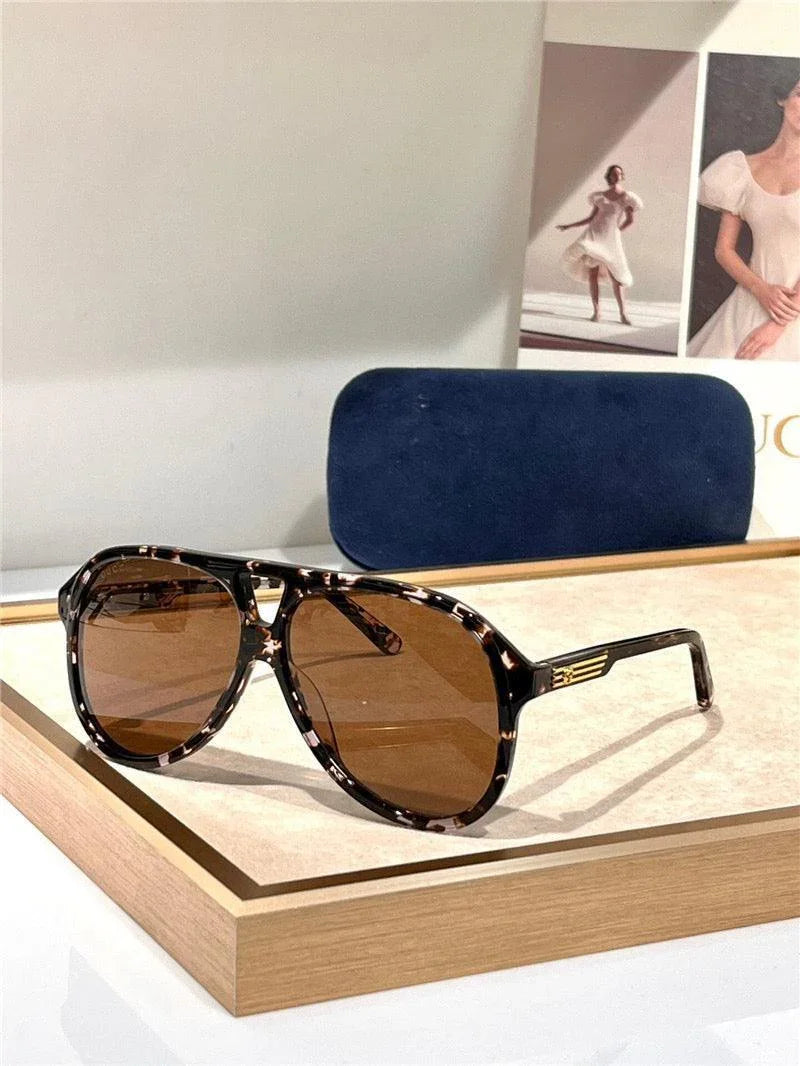Tortoiseshell aviator sunglasses with brown polarized lenses on display tray