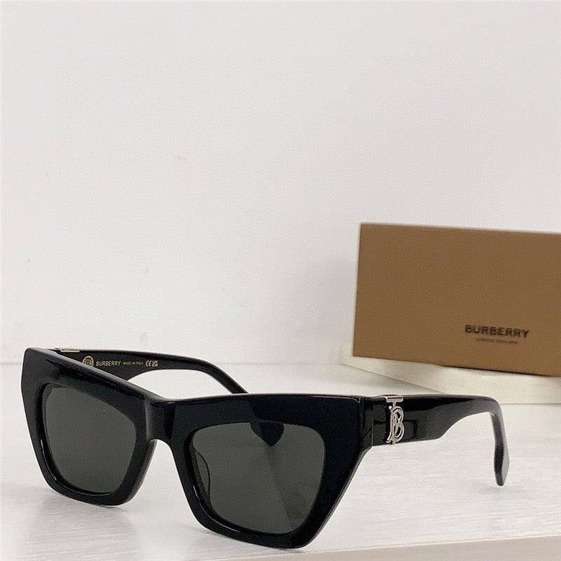 Black square sunglasses with thick frames and dark lenses on a white surface