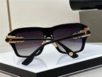 Luxury square black sunglasses with gold accents and gradient lenses on display stand