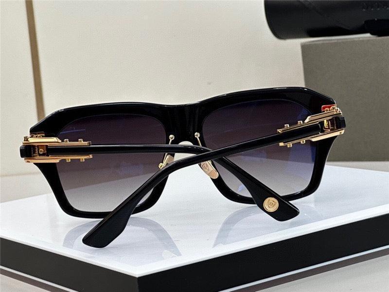 Luxury square black sunglasses with gold accents and gradient lenses on display stand