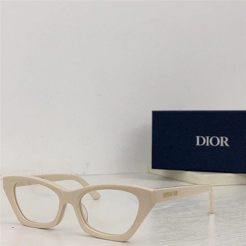 Beige cat-eye eyeglasses frames with DIOR case, trendy designer eyewear on white table