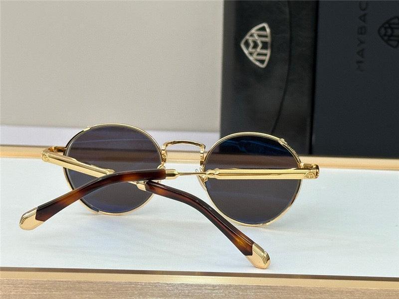 Round sunglasses with gold metal frame and dark lenses on display, tortoise temple tips