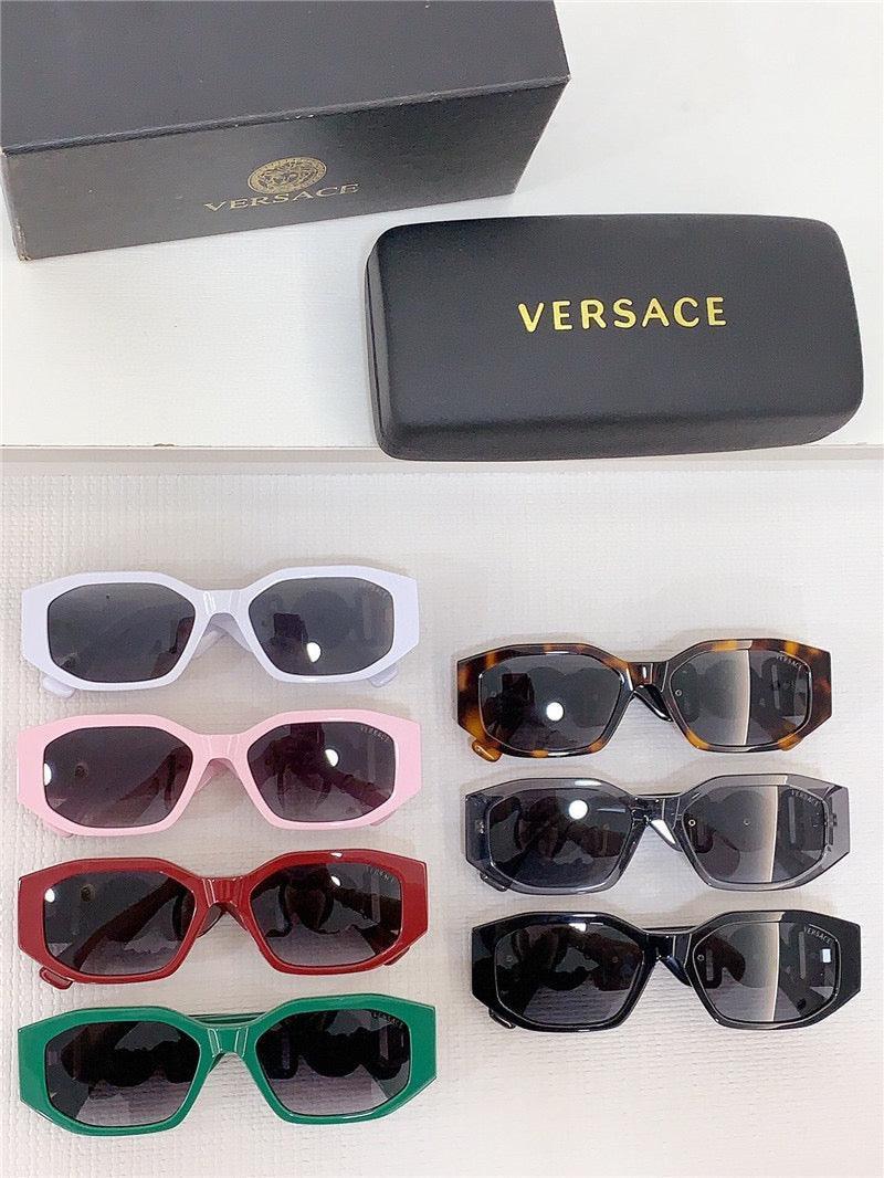 Assorted Versace rectangular sunglasses in six colors with branded case and box on white surface