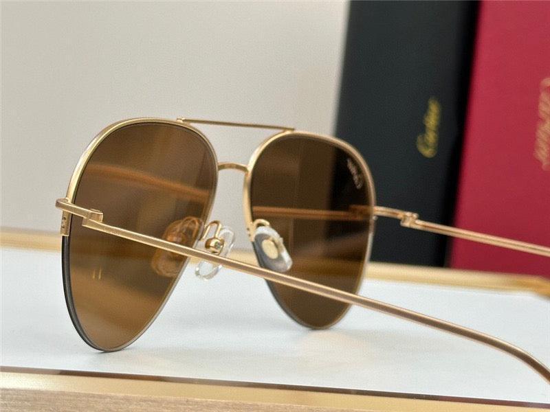 Gold aviator sunglasses with brown polarized lenses and thin metal frame on display