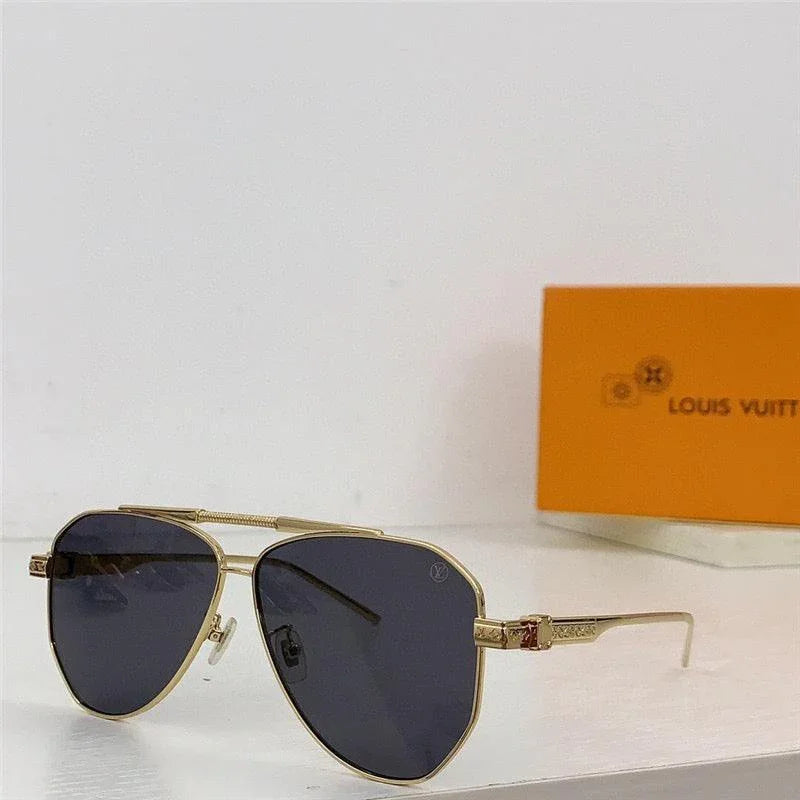 Gold metal aviator sunglasses with dark polarized lenses, displayed on a white surface