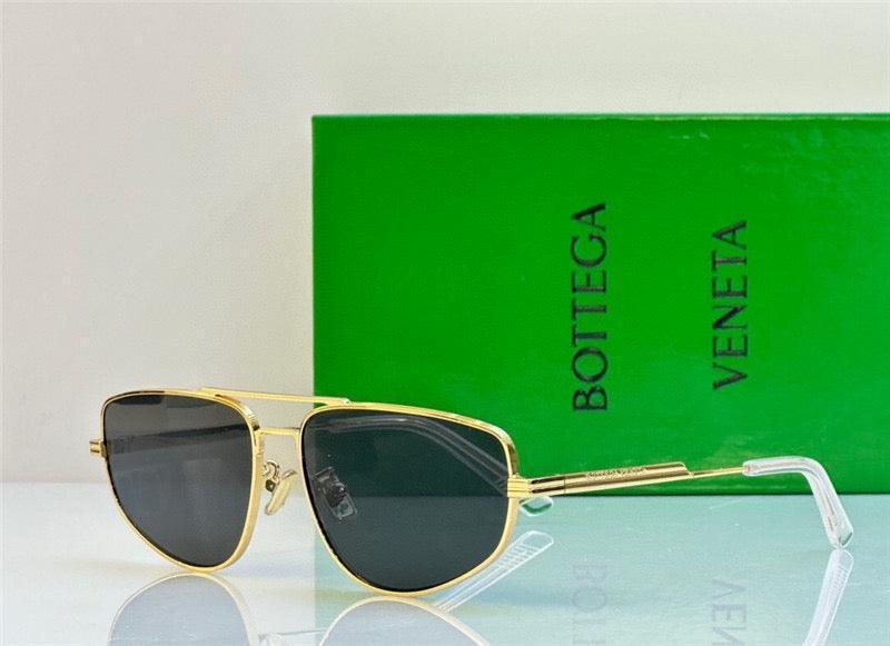 Gold aviator sunglasses with dark polarized lenses in front of green Bottega Veneta box