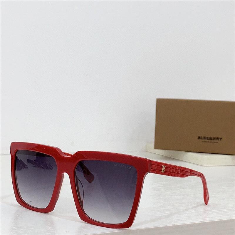 Red oversized square sunglasses with gradient lenses on a white surface