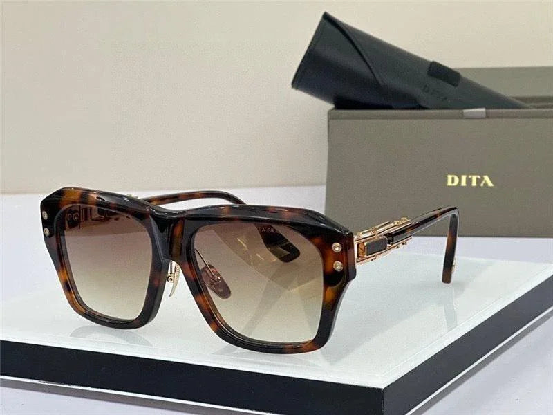 Tortoiseshell square sunglasses with gradient lenses and gold accents on display