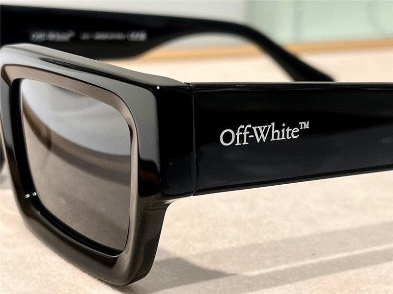 Black rectangular sunglasses with thick frames and Off-White logo on the temple
