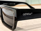 Black rectangular sunglasses with thick frames and Off-White logo on the temple