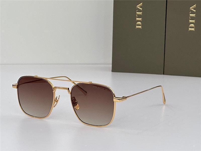 Gold frame sunglasses with square gradient brown lenses on white surface, luxury eyewear