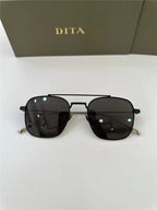 Black square aviator sunglasses with dark lenses on white background, DITA box behind