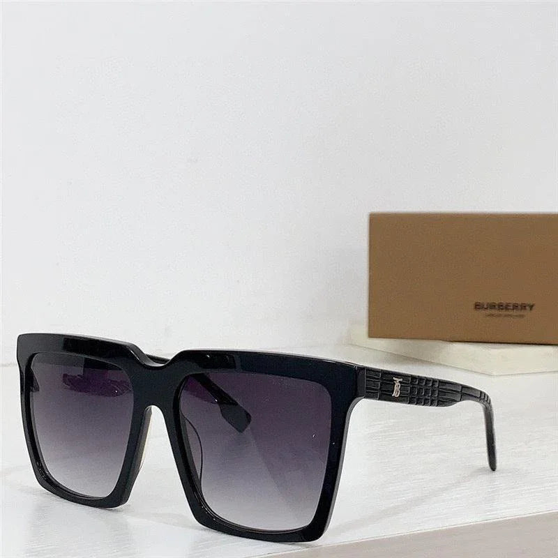 Square oversized black sunglasses with gradient lenses on a white surface
