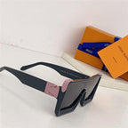 Black oversized square sunglasses with pink accents, UV protection, on white surface