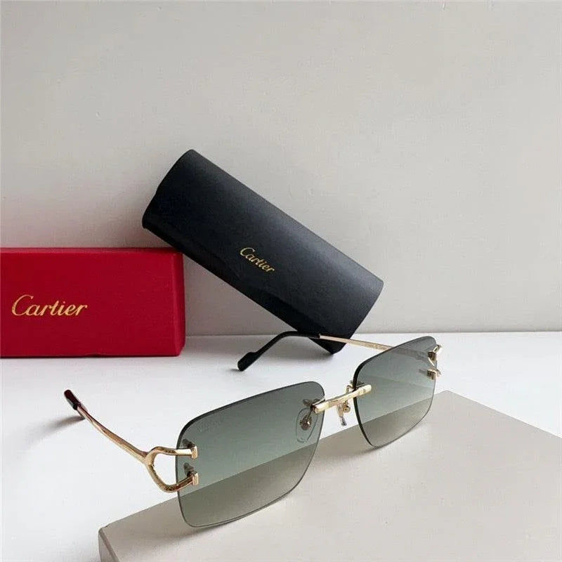 Luxury Cartier sunglasses with gold frame and gradient lenses, next to branded case and box