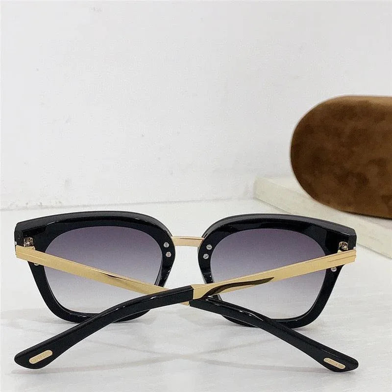 Black and gold sunglasses with gradient lenses, UV400 protection, stylish thick frames.