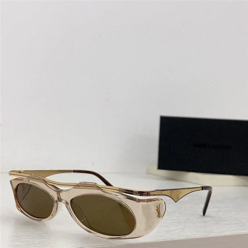 Beige cat eye sunglasses with brown tinted lenses and gold accents on a white surface