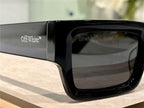Close-up of black square sunglasses with Off-White branding, stylish thick frames