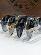 Luxury sunglasses with gold, silver, and black metal frames and dark gradient lenses