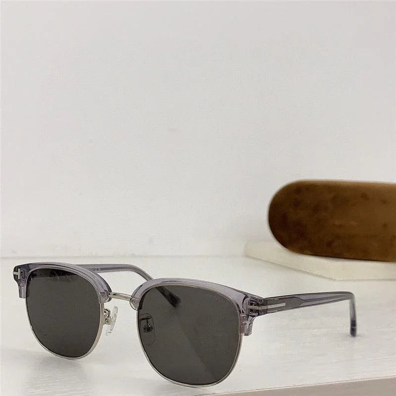 Rectangular polarized sunglasses with transparent grey frames and dark lenses on a white surface