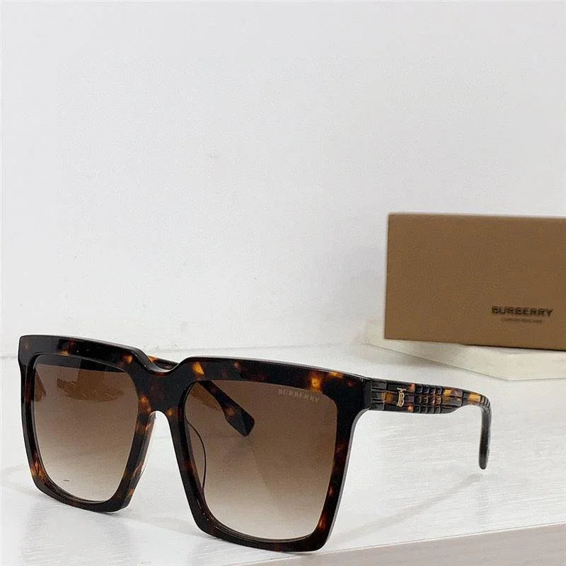 Tortoise shell square sunglasses with brown gradient lenses on white surface