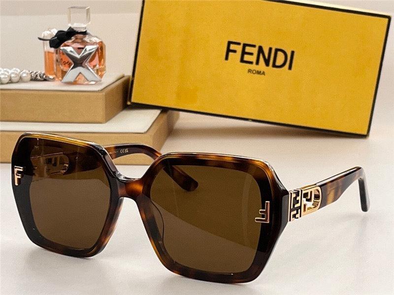 Tortoiseshell square sunglasses with brown lenses and gold accents, luxury accessories display