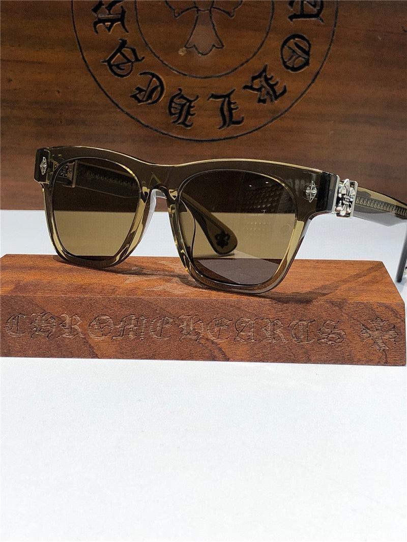 Stylish square sunglasses with dark lenses and silver accents, displayed on a wooden stand.