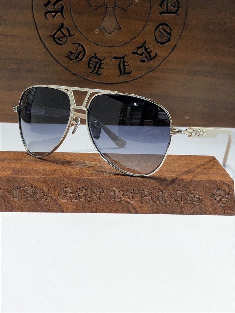 Metal aviator sunglasses with blue gradient lenses and engraved detailing on the arms.