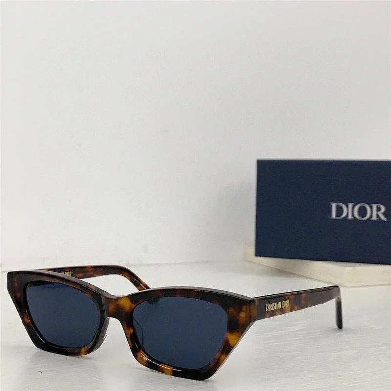Tortoiseshell cat-eye sunglasses with dark lenses and Christian Dior branding, designer accessory.