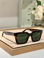 Tortoise shell square sunglasses with green lenses on display, trendy polarized eyewear