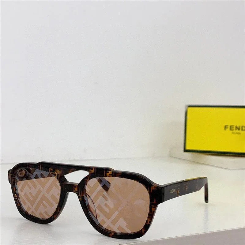 Tortoiseshell square sunglasses with brown patterned lenses on a white surface