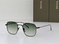 Square frame sunglasses with black metal arms and gradient green lenses on white background