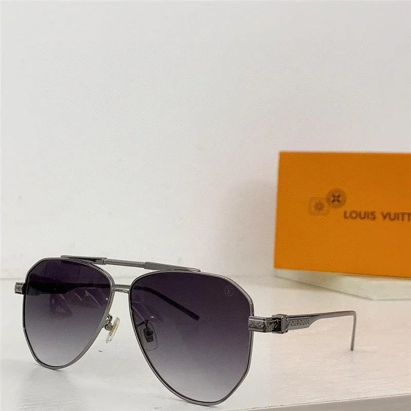 Aviator sunglasses with gradient black lenses and metal frame on a white surface