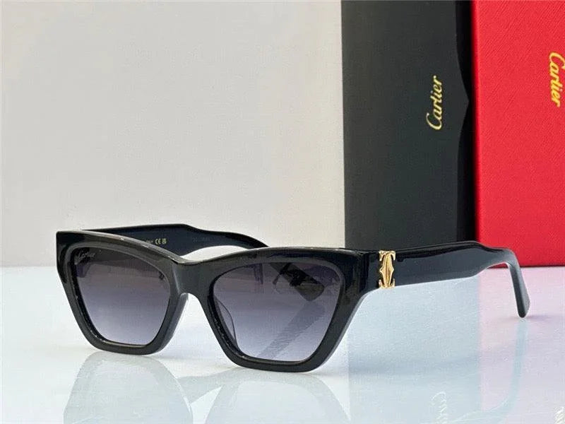 Black cat eye sunglasses with gold accent and gradient lenses, luxury accessory display