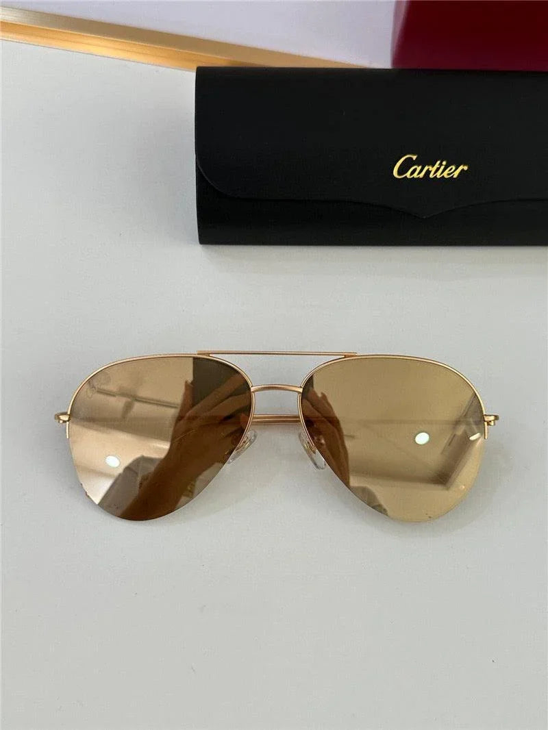 Gold aviator sunglasses with brown tinted lenses and black case on a white surface