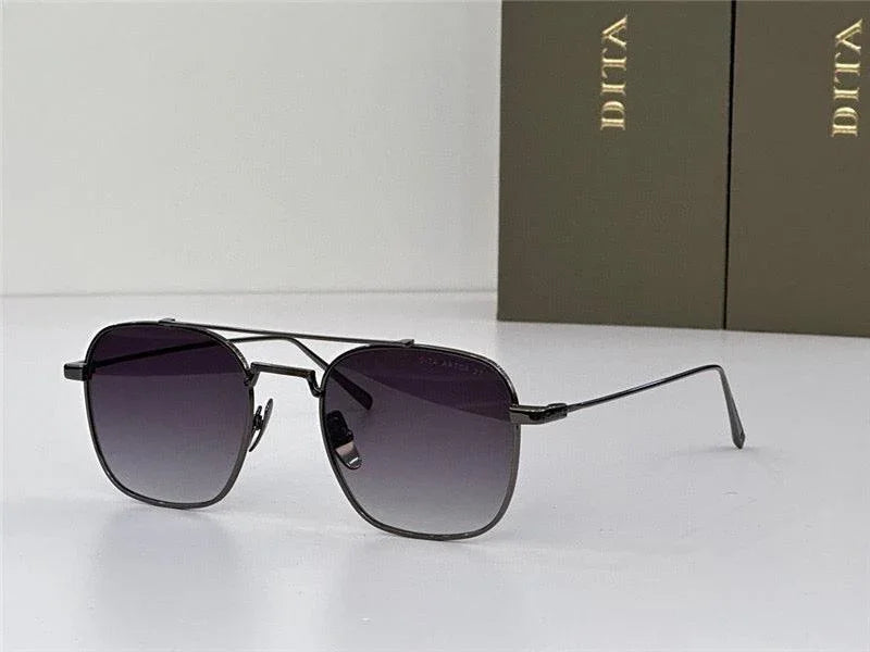 Square aviator sunglasses with black frames and gradient lenses on a white surface