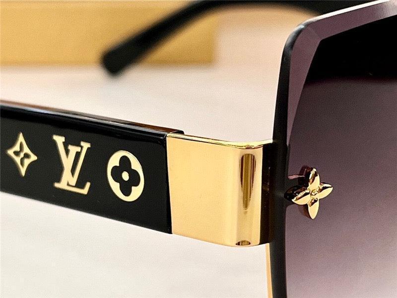 Luxury black sunglasses with gold accents and engraved logo details on temple arms
