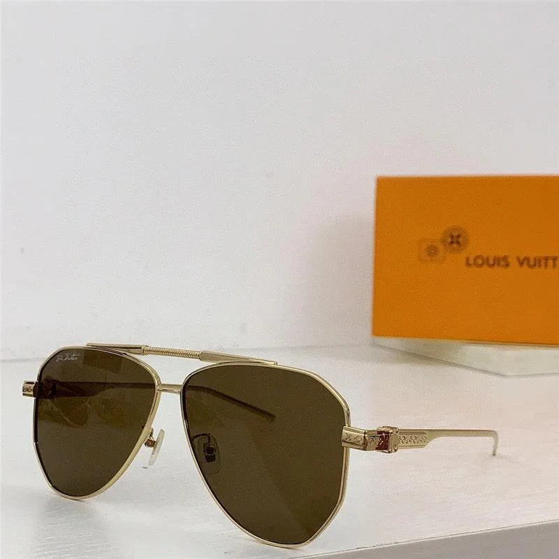 Gold aviator sunglasses with brown polarized lenses on a white surface, orange case in background