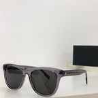 Trendy black polarized sunglasses with transparent frames on a white surface