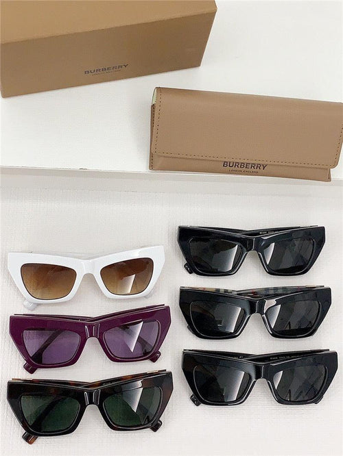 Assorted Burberry women’s sunglasses with cat-eye and square frames in various colors, displayed with branded case and box.