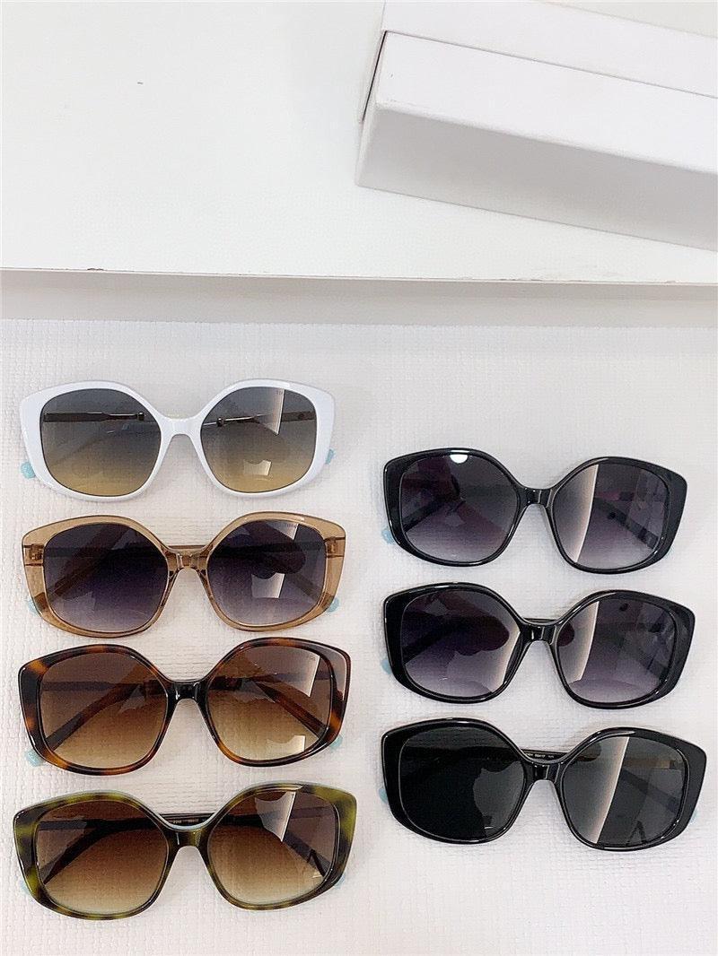 Assorted oversized sunglasses with gradient and dark lenses in stylish frames, displayed on white