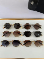 Six pairs of round sunglasses with metal frames and tinted lenses displayed in a case.