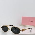 Gold oval sunglasses with dark lenses on white surface, pink Miu Miu case in background