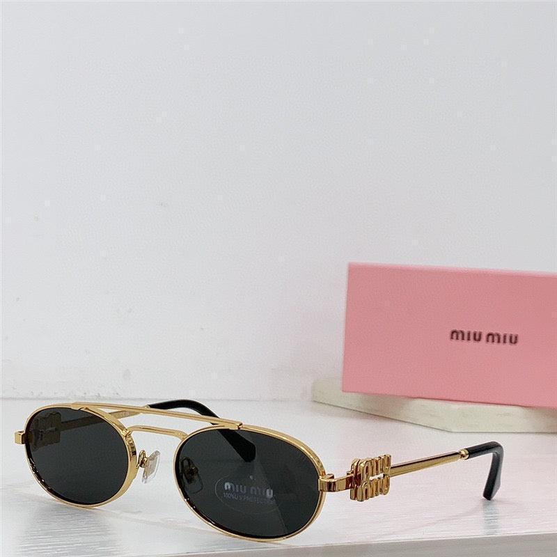 Gold oval sunglasses with dark lenses on white surface, pink Miu Miu case in background