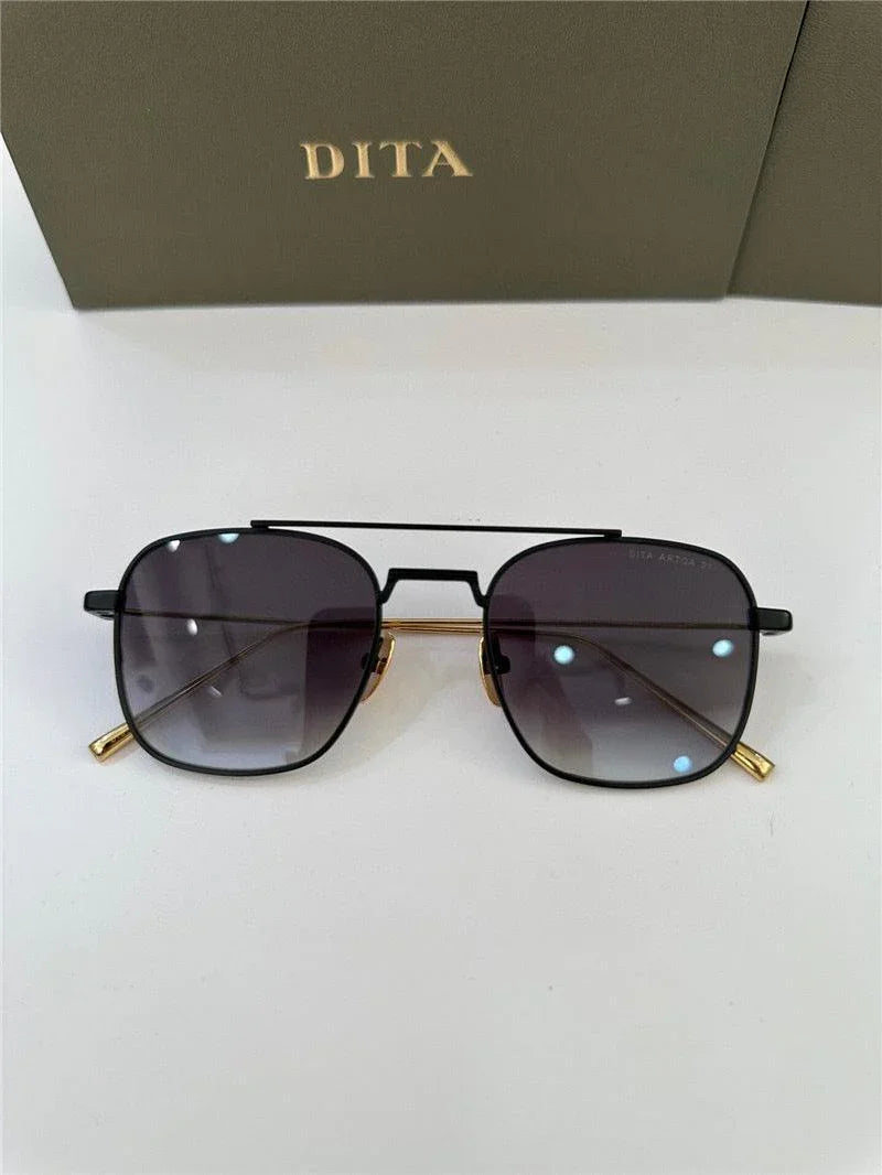 DITA black and gold square sunglasses with gradient lenses on white background